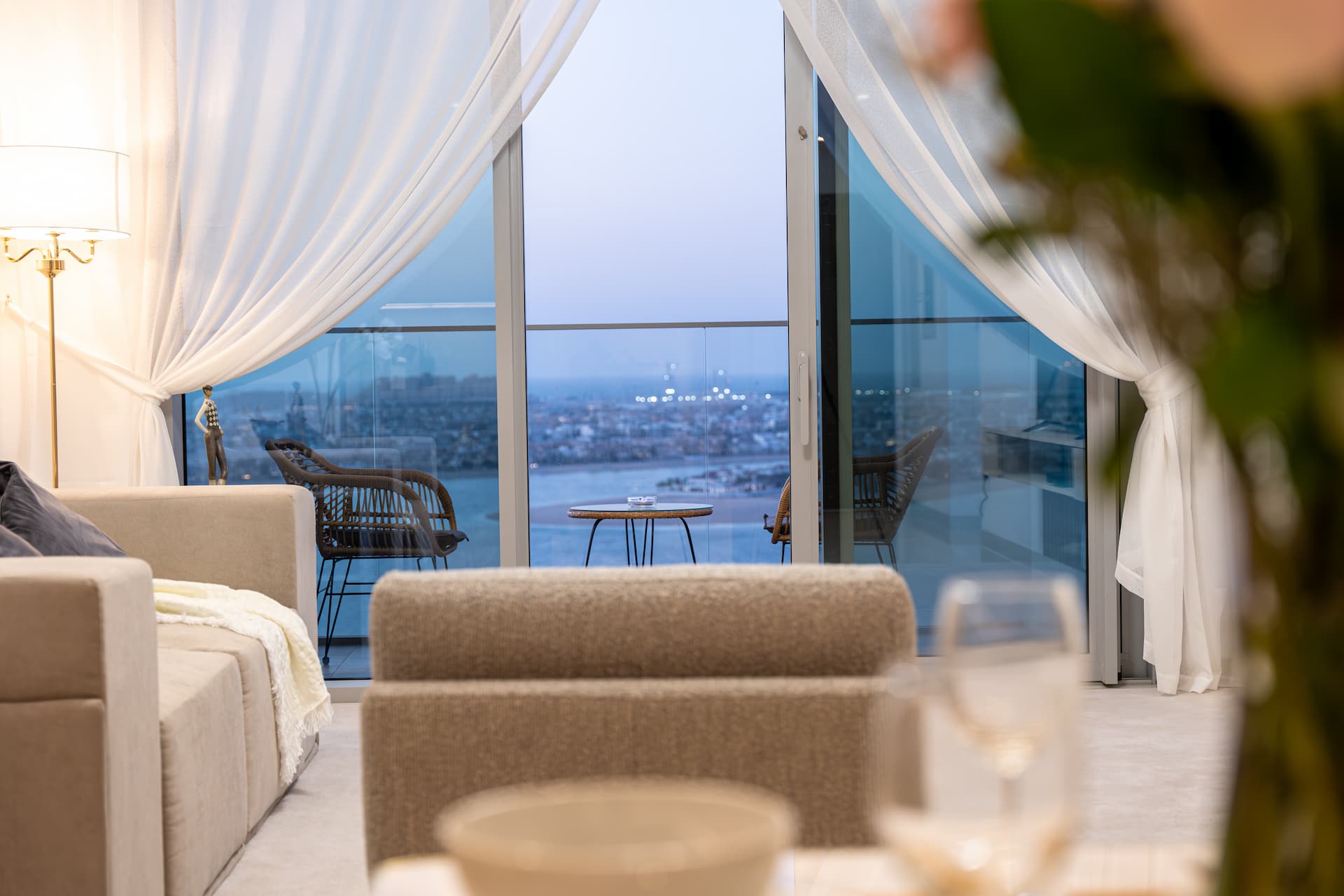 Panoramic golden hour view of Emaar Beachfront Dubai with Arabian Gulf and Palm Jumeirah