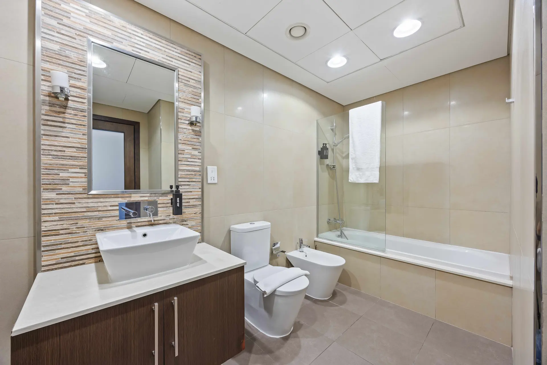 Modern bathroom with bathtub at Burj Daman DIFC Dubai