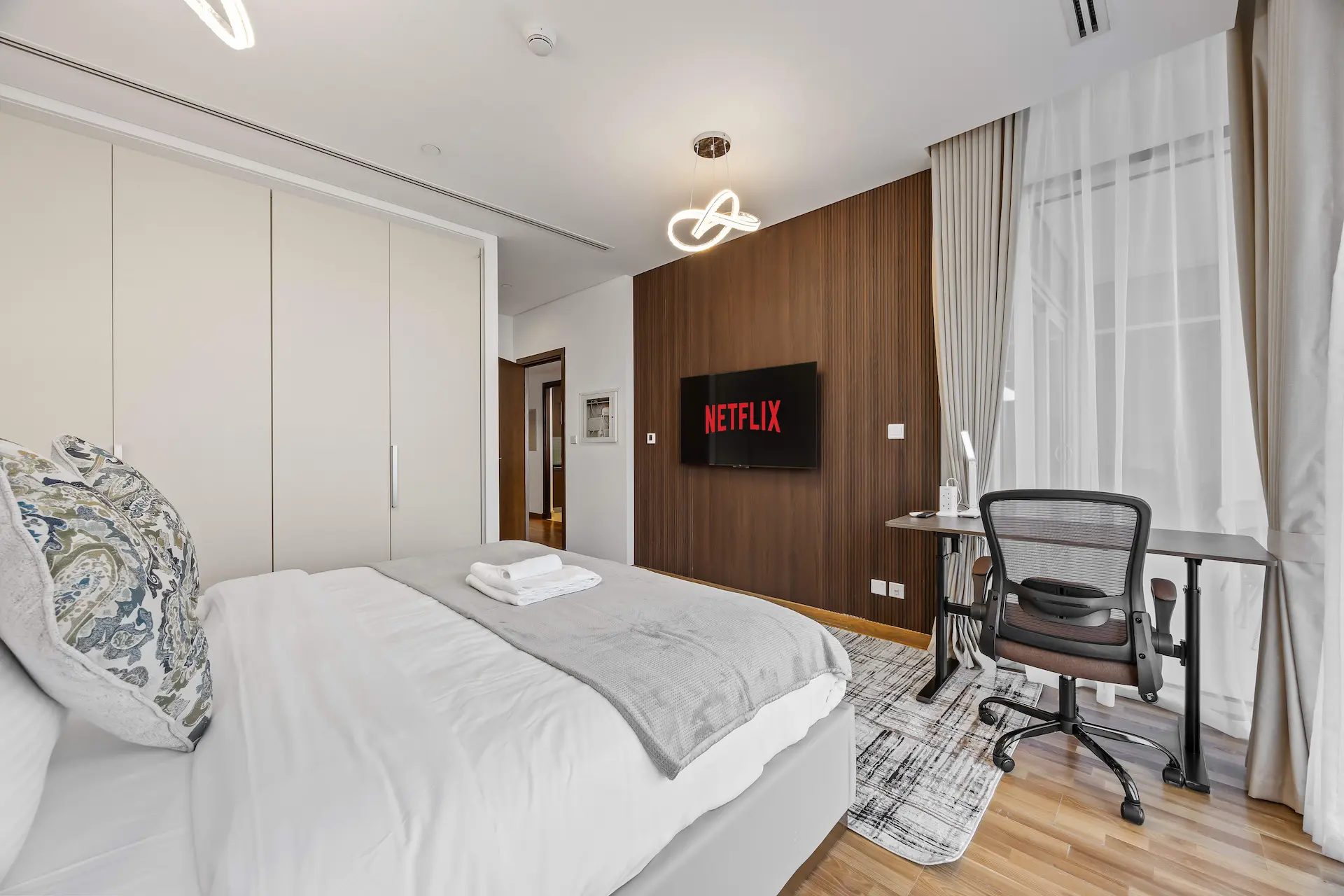 Bedroom with executive desk at Burj Daman DIFC Dubai