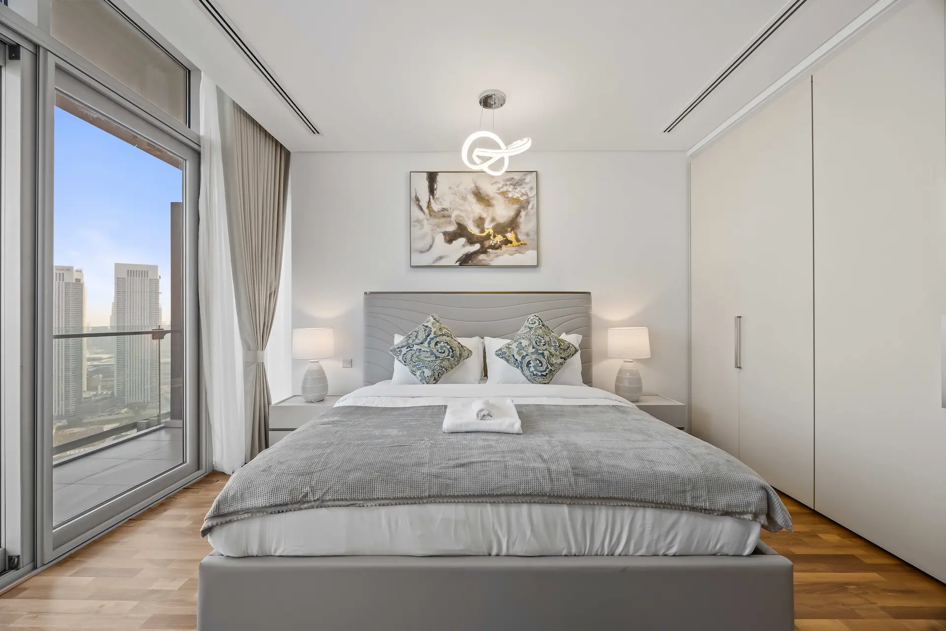 Master bedroom with skyline views at Burj Daman DIFC Dubai