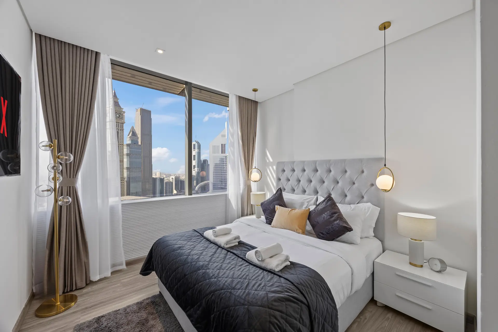 Executive bedroom with Emirates Towers view at Sky Gardens DIFC Dubai