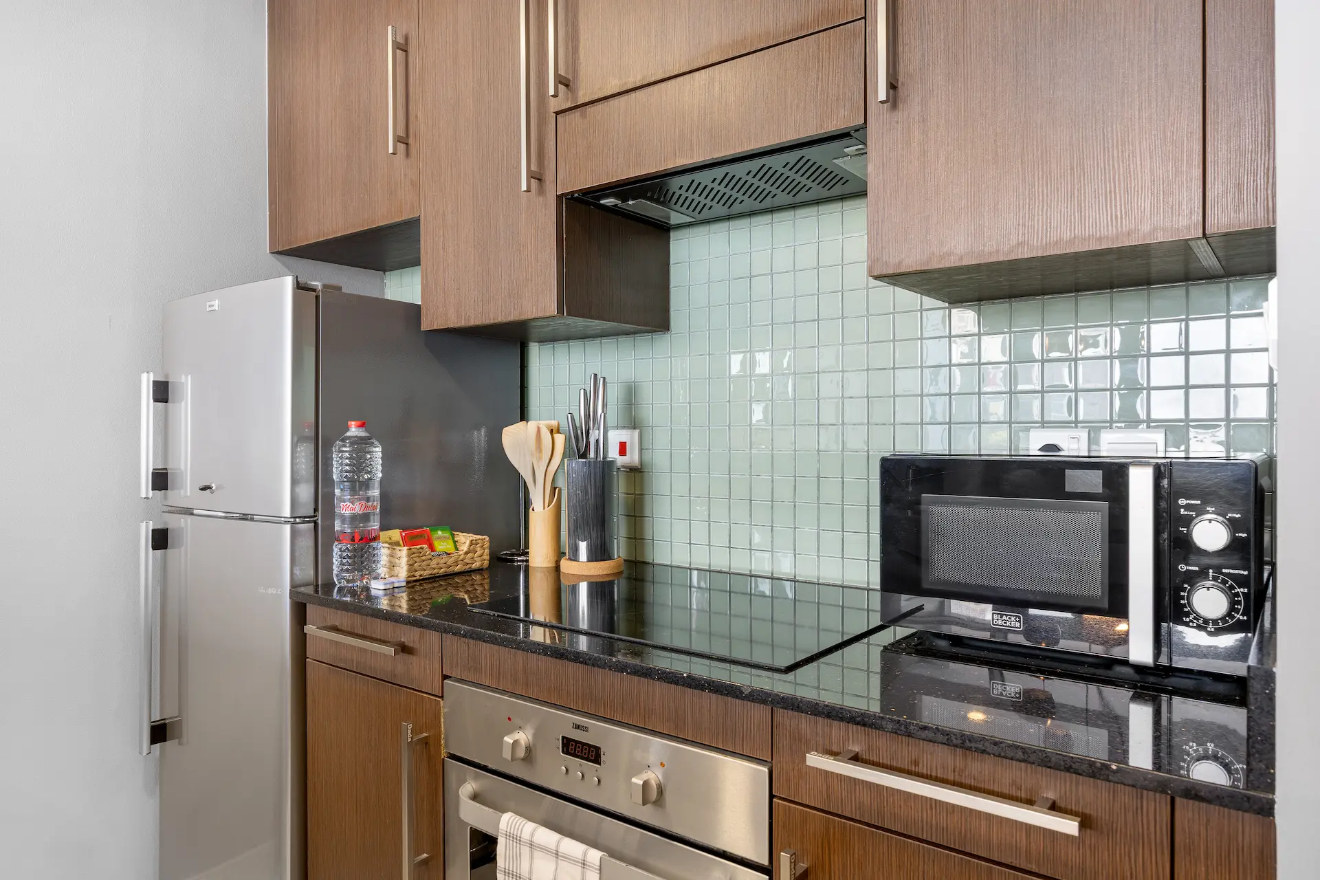 Kitchen appliances and storage at Burj Daman DIFC Dubai