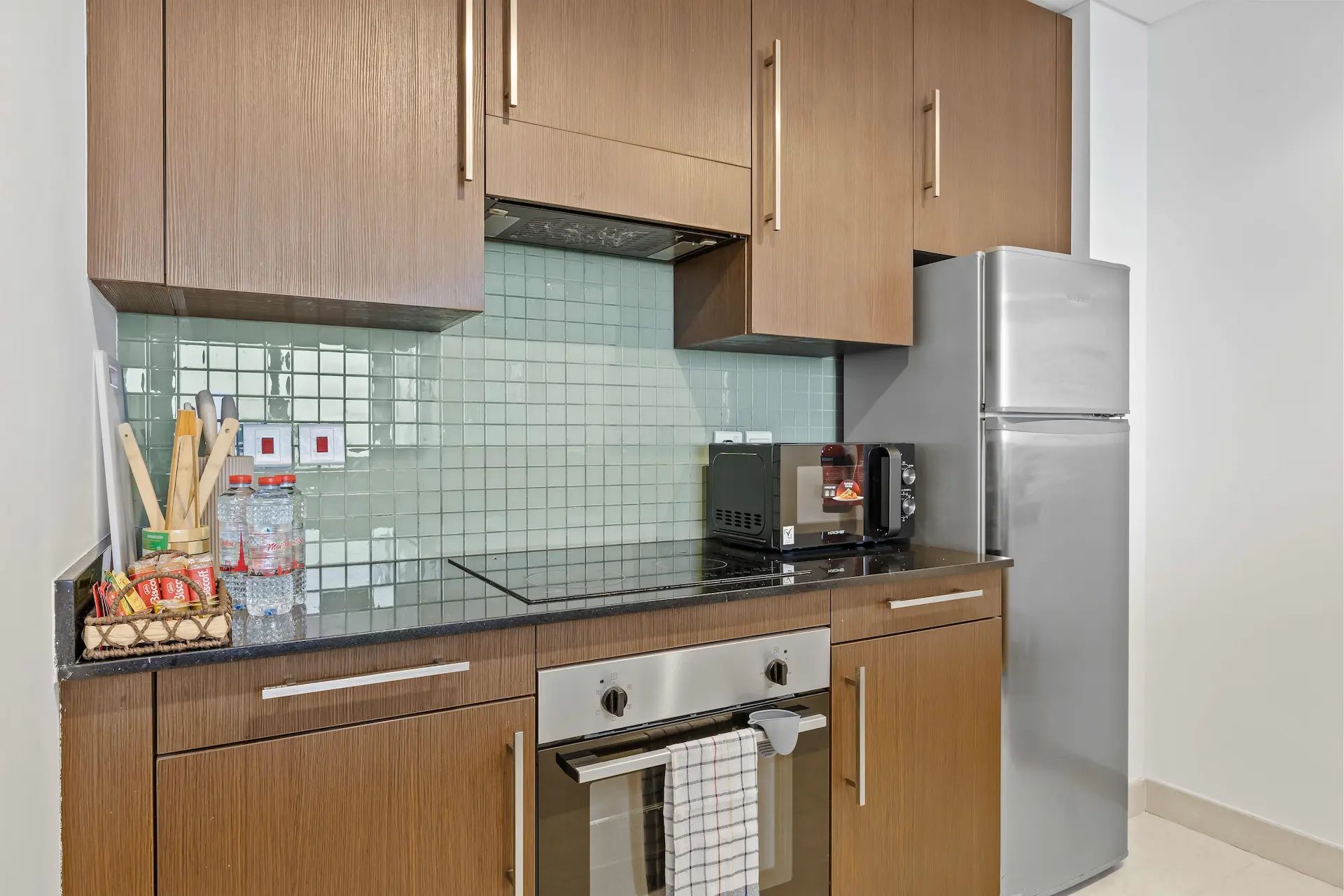 Kitchen appliances and storage at Burj Daman DIFC Dubai