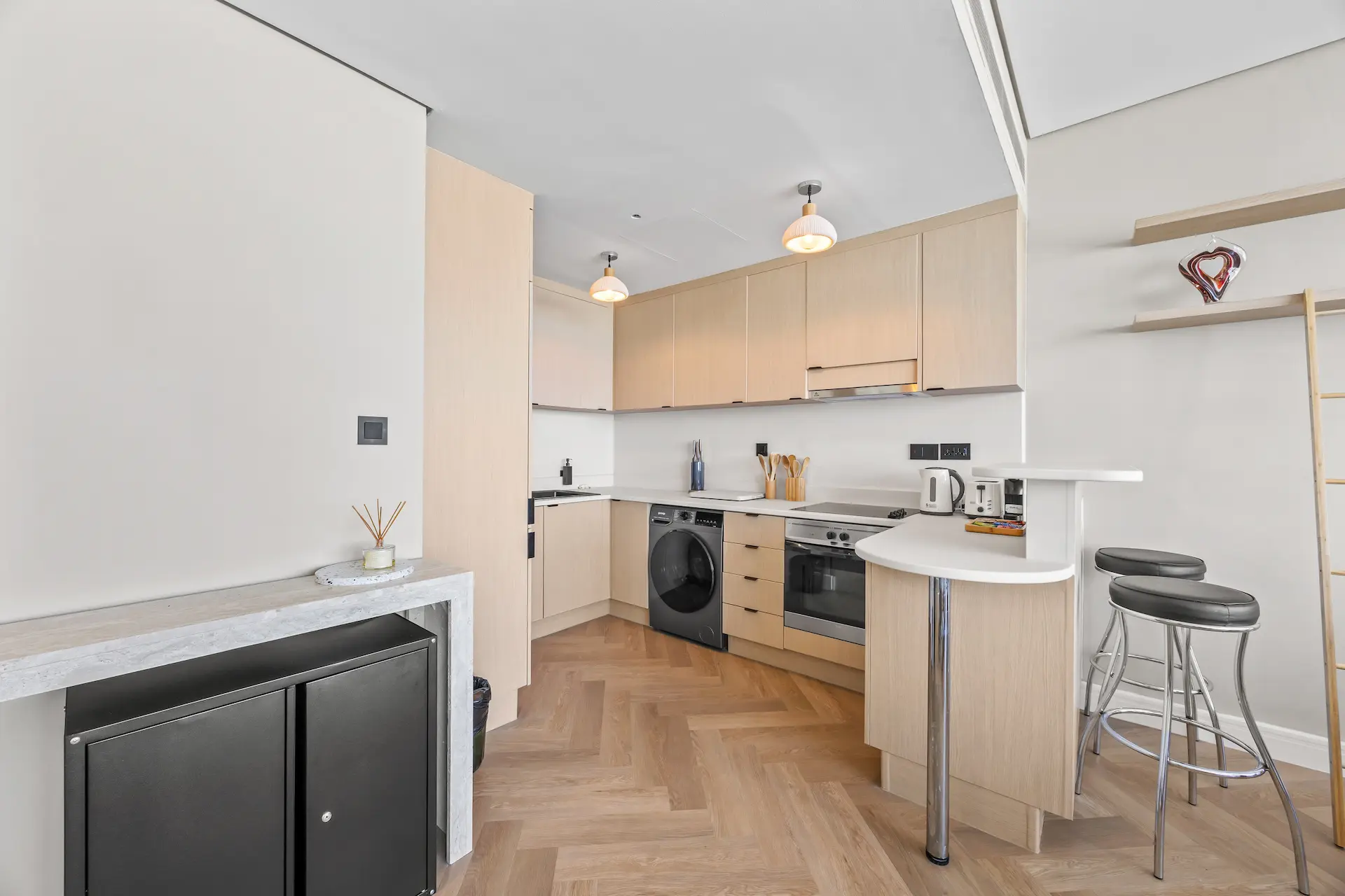 Fully equipped kitchen with breakfast bar at Sky Gardens DIFC Dubai