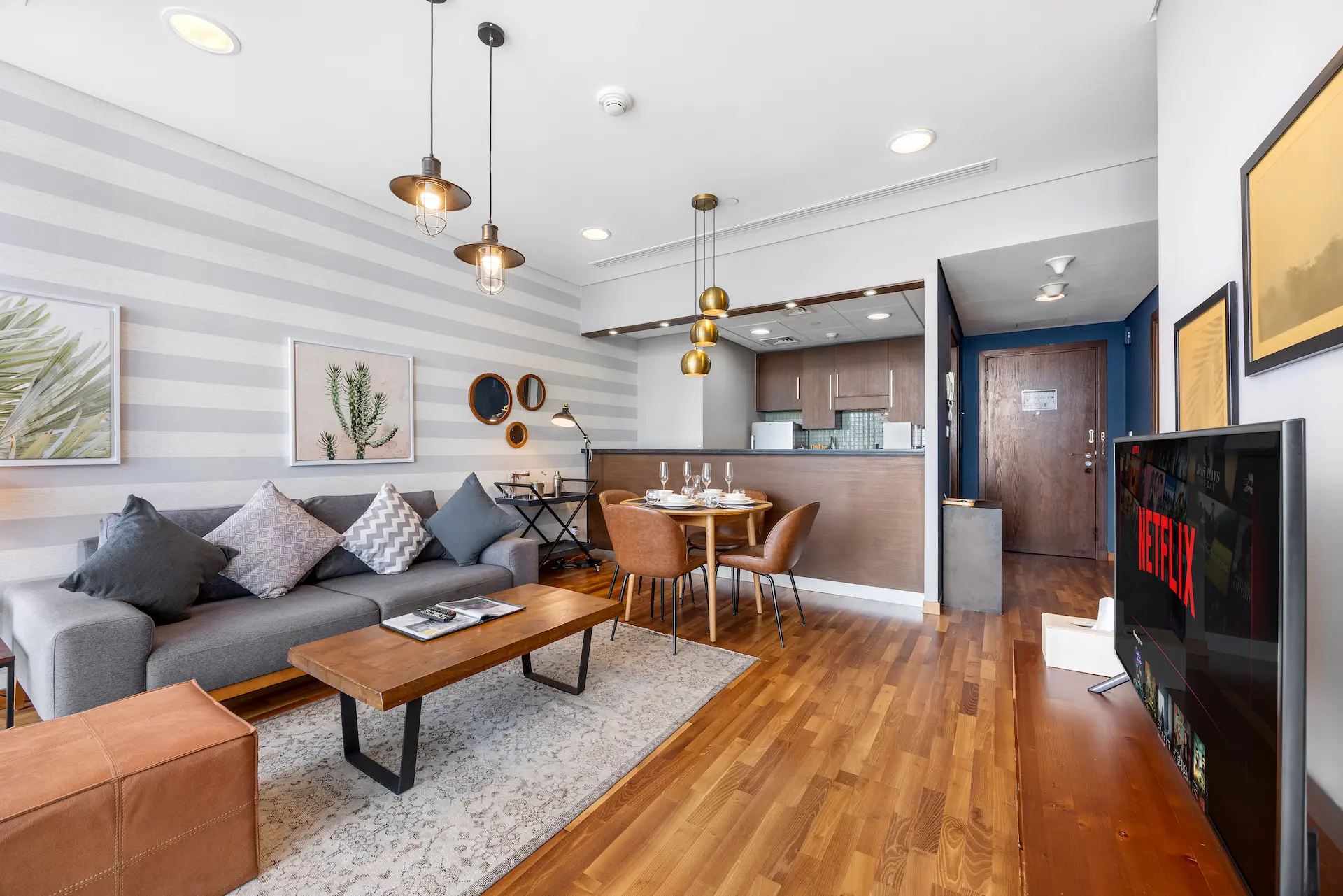 Open plan living area with balcony access at Burj Daman DIFC Dubai