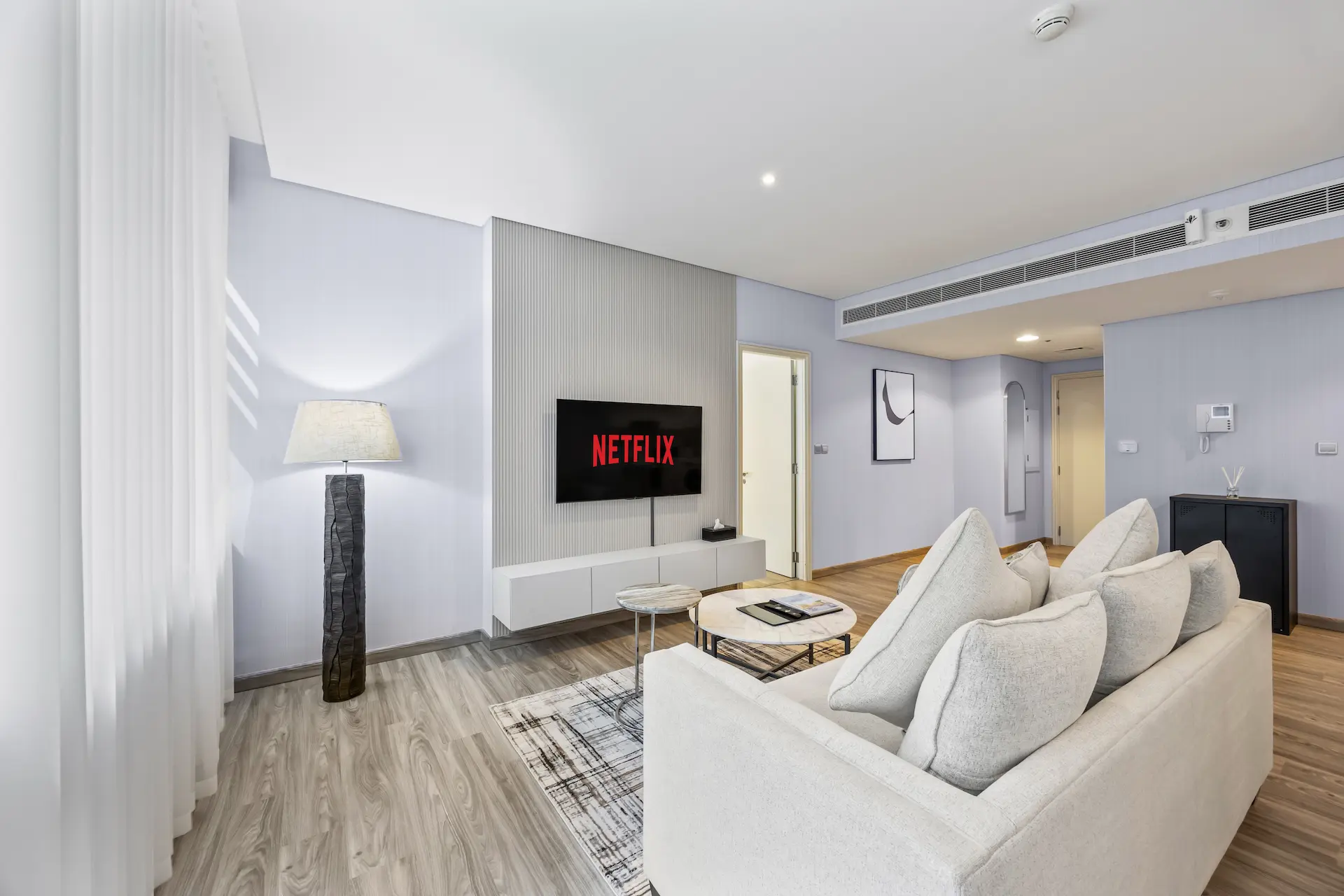 Spacious lounge with Netflix TV in premium one bedroom apartment Sky Gardens DIFC Dubai