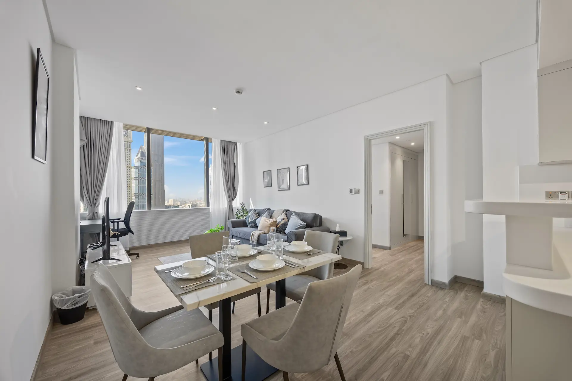 Dining and lounge area with Emirates Towers views at Sky Gardens DIFC Dubai