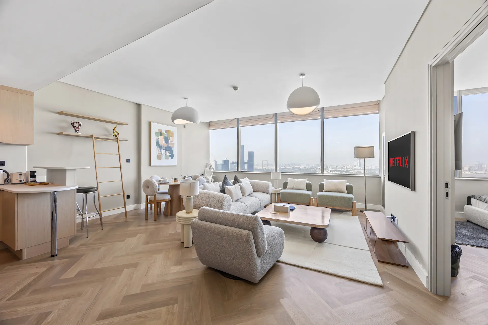 Spacious open-plan living area with panoramic city views at Sky Gardens DIFC Dubai