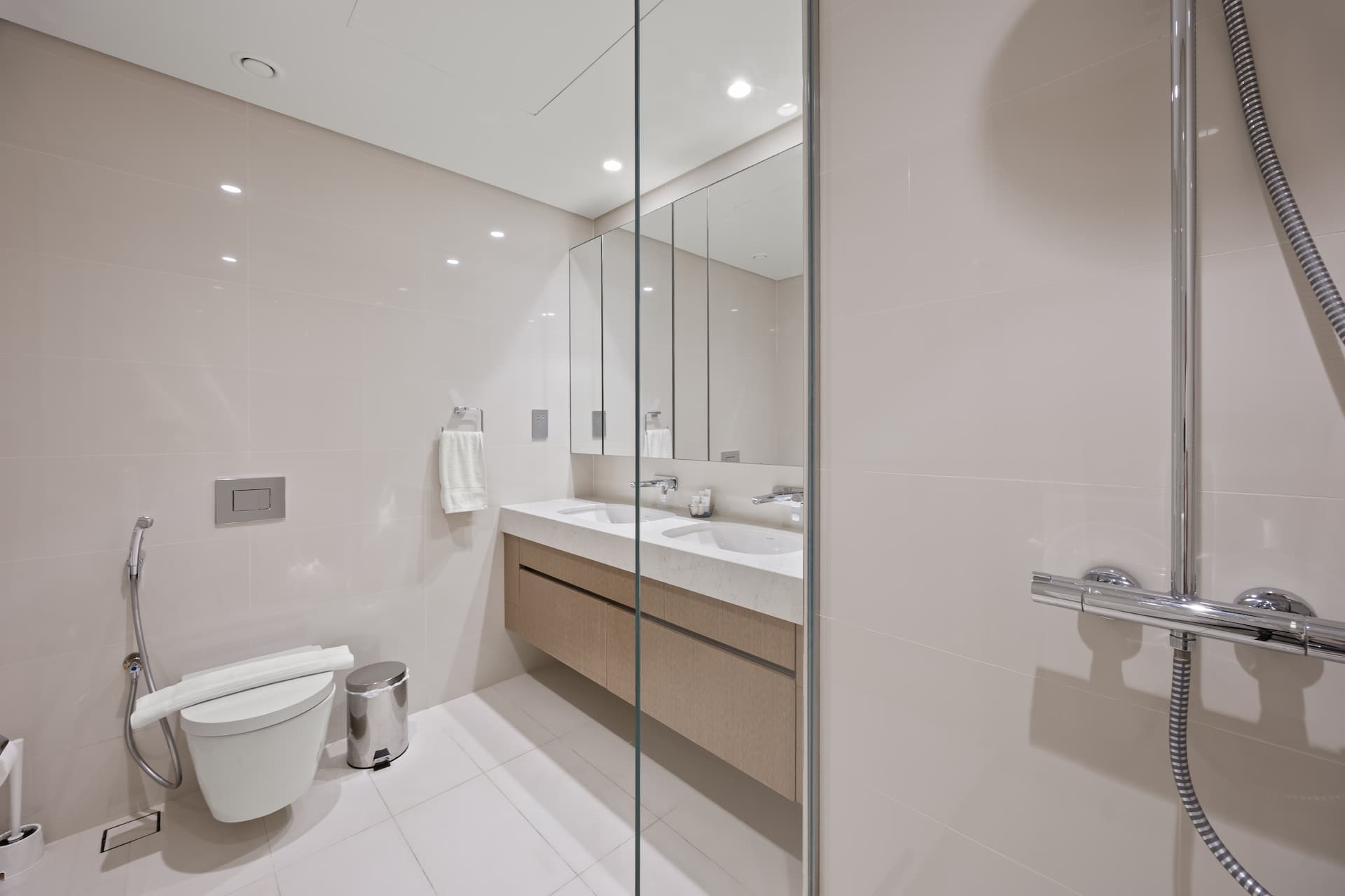 Spacious ensuite with dual sinks and glass-enclosed shower in premium two bedroom apartment Beach Isle Tower One Dubai