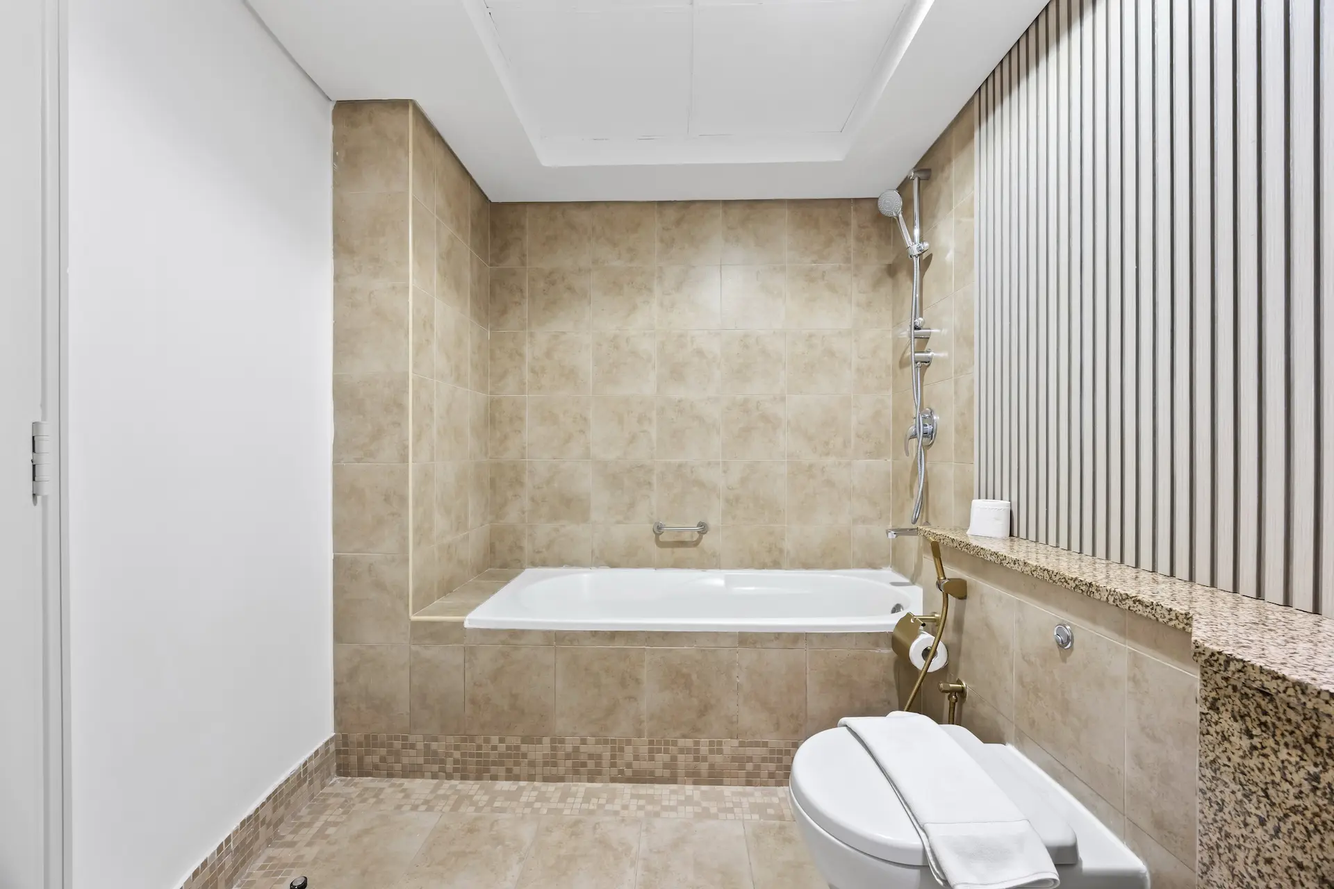 Bathroom with bathtub and premium finishes in executive studio Sky Gardens DIFC Dubai