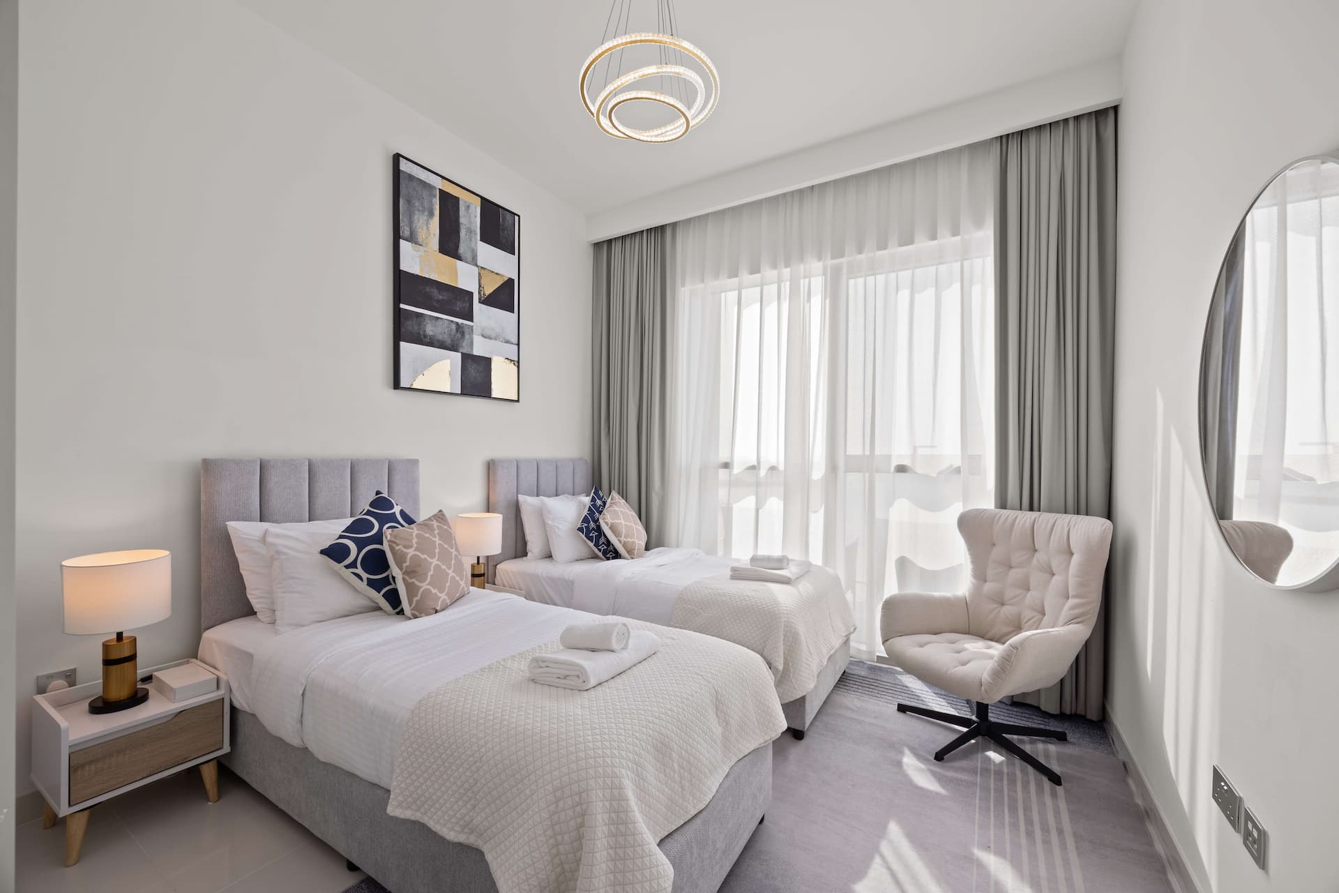 Elegant twin bedroom with designer lighting and premium linens in two bedroom sea view apartment Beach Isle Tower One Dubai