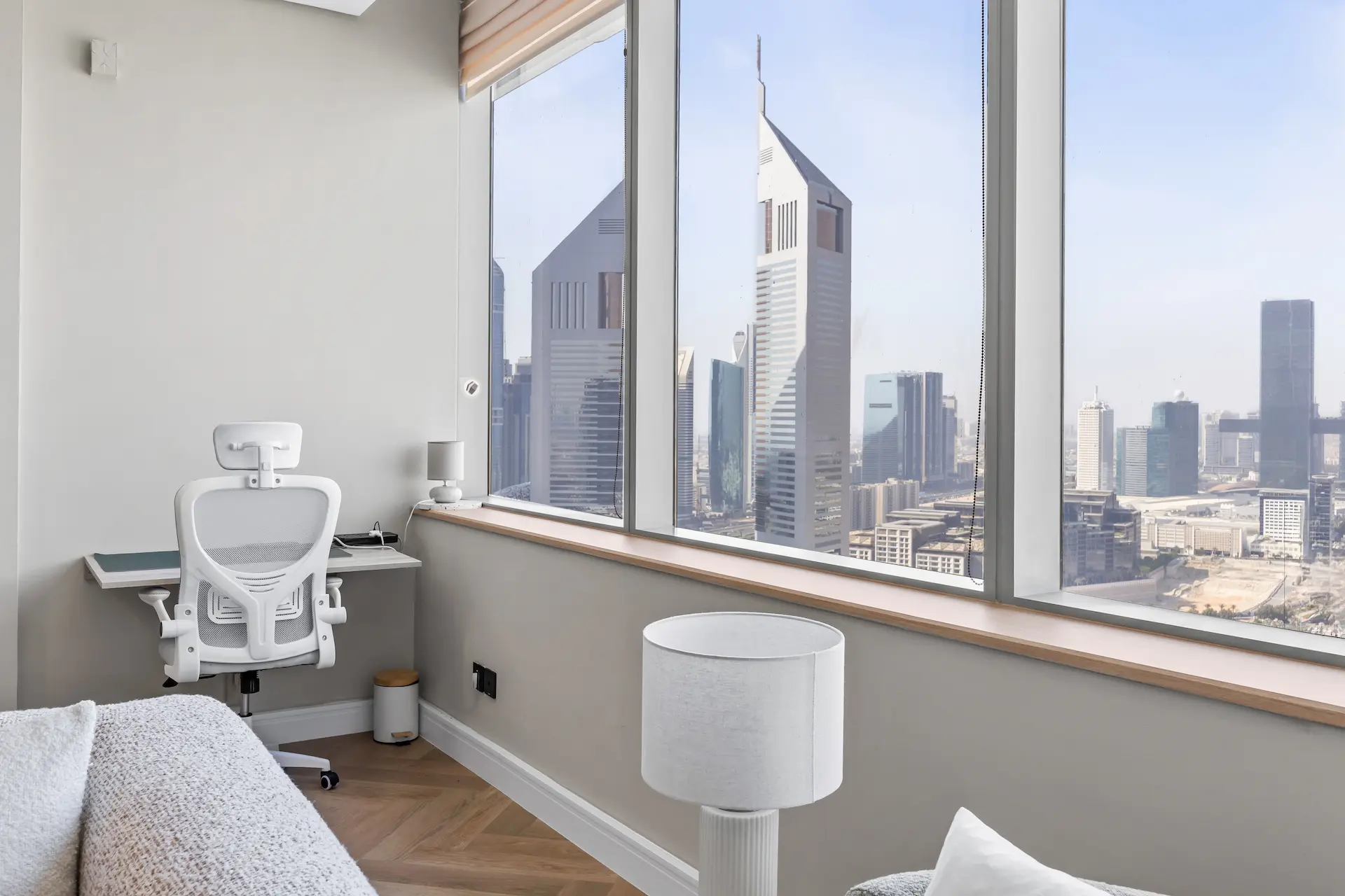 Ergonomic workspace with Emirates Towers views at Sky Gardens DIFC Dubai