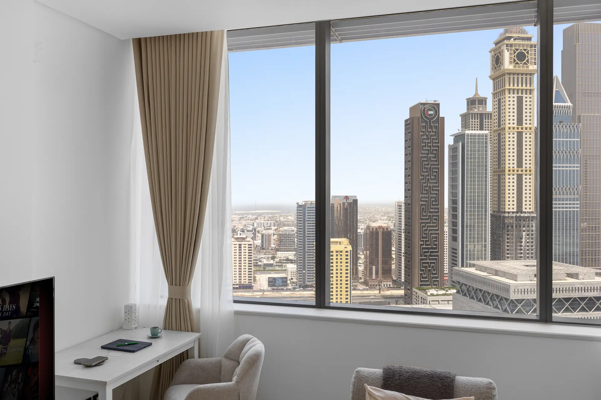 Workspace and lounge with panoramic DIFC skyline view at Sky Gardens Dubai