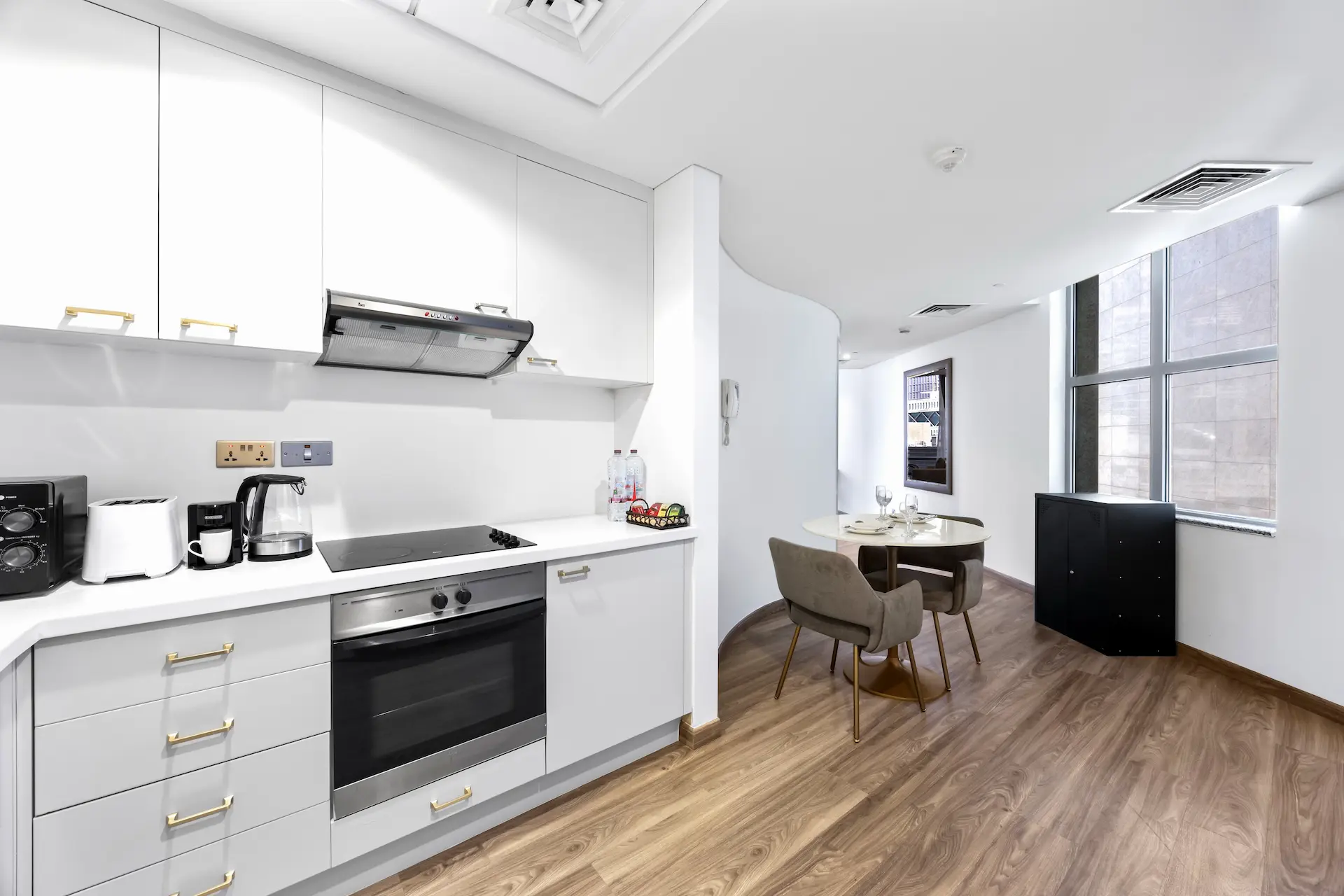 Fully equipped kitchen and dining area in executive studio Sky Gardens DIFC Dubai