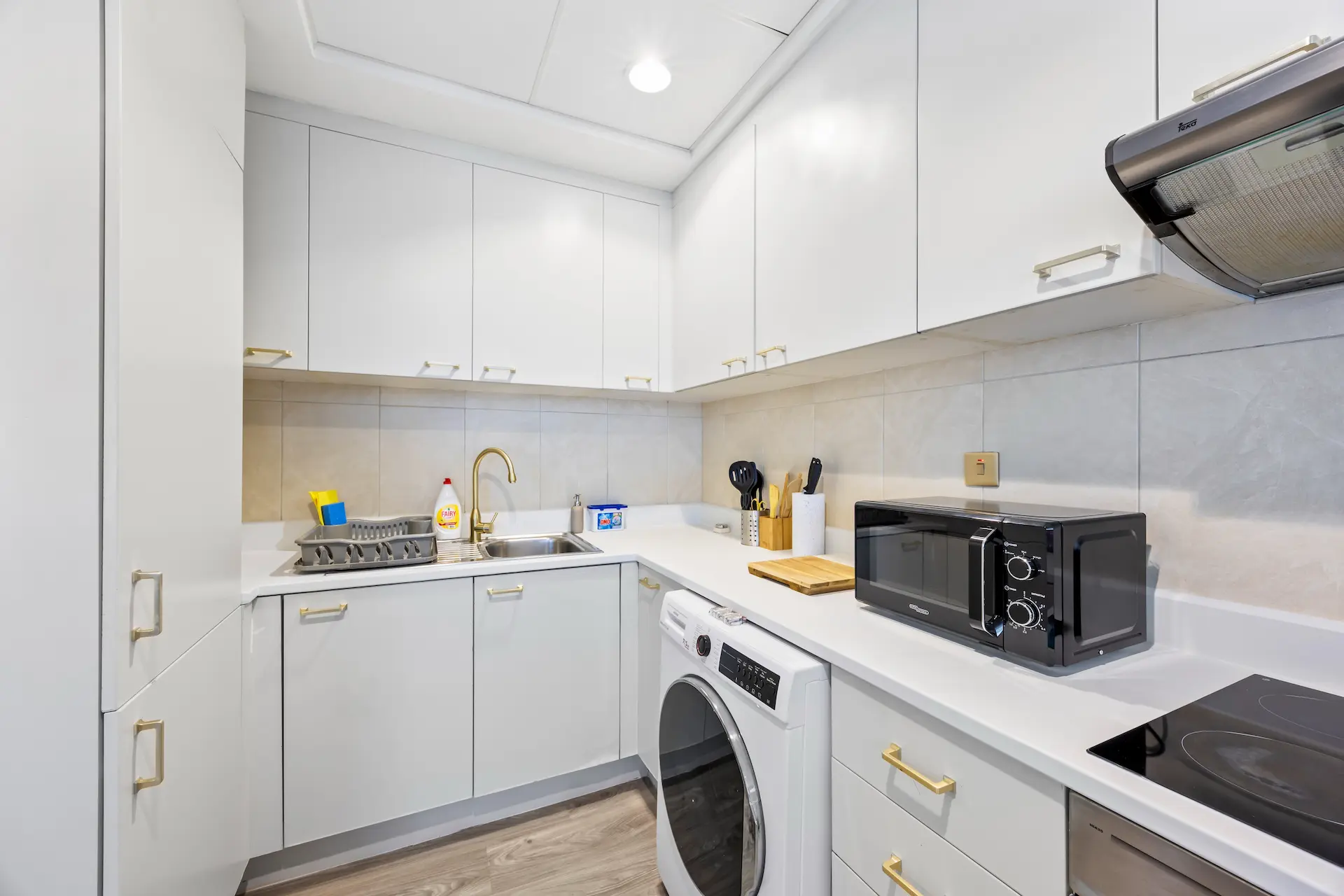 Fully equipped kitchen with washer dryer in premium one bedroom apartment Sky Gardens DIFC