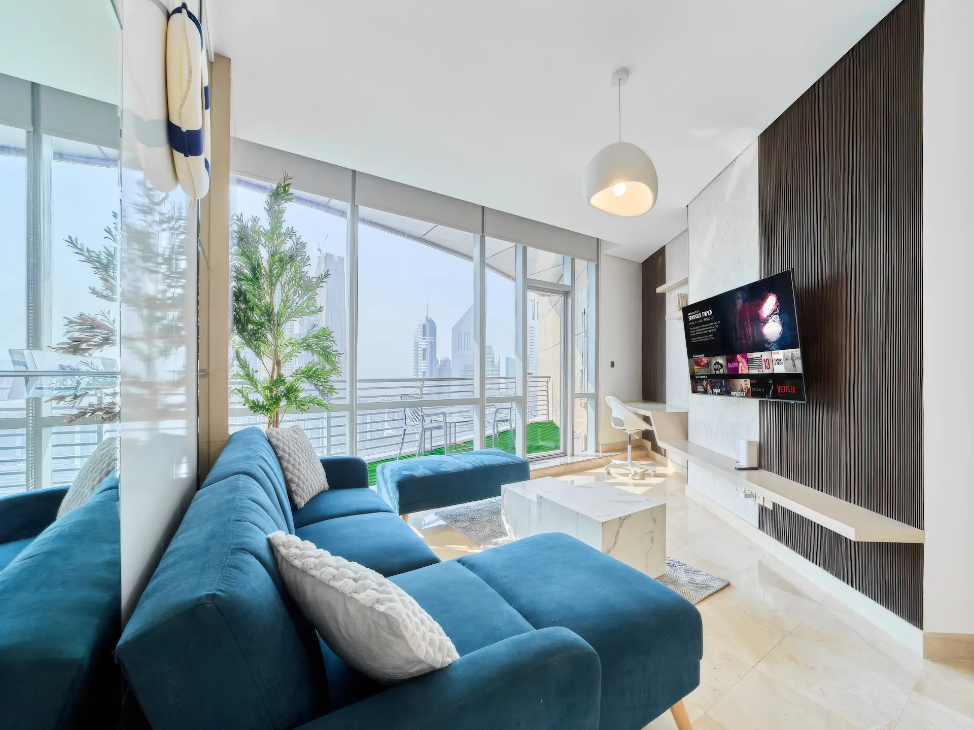 Sky View Studio sofa and living space with skyline view